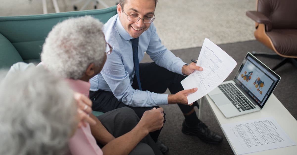 An older couple going over their finances at home
