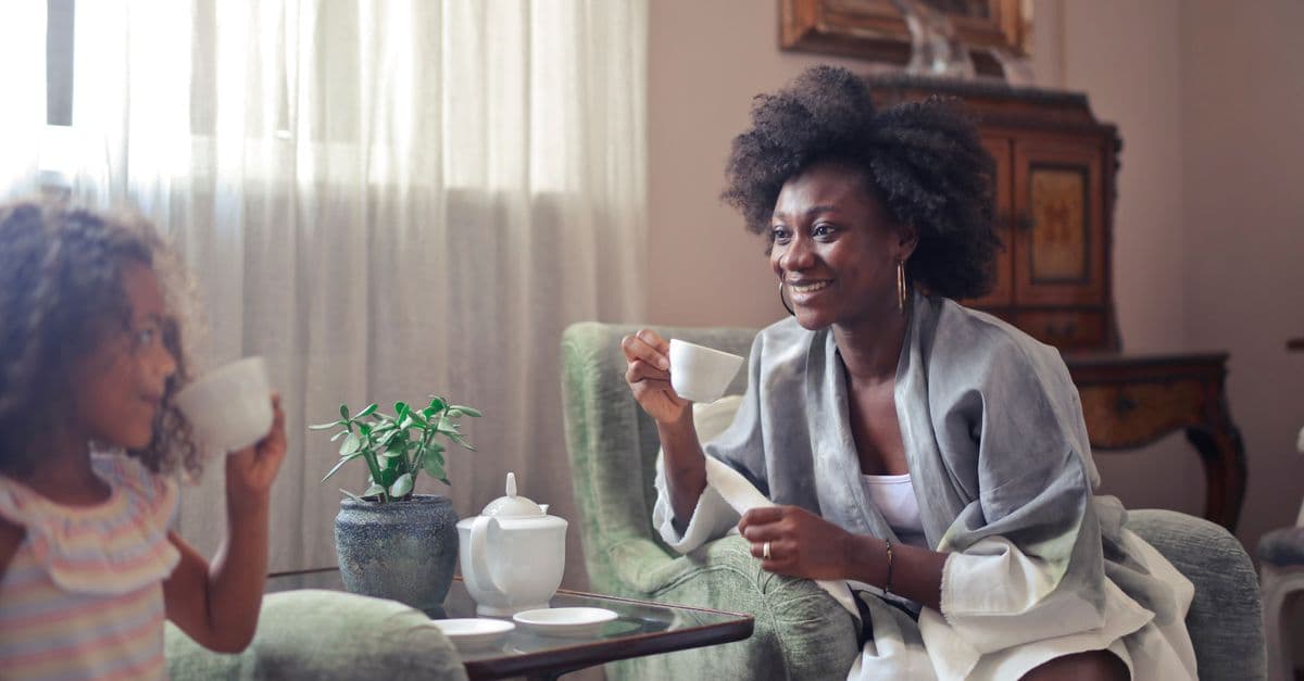 A carer and family member sharing a warm moment at home