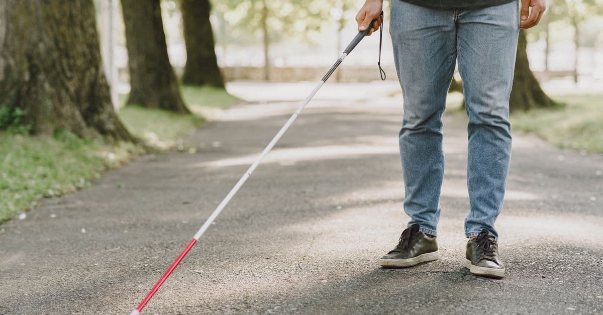 A person with disability walking independently outdoors