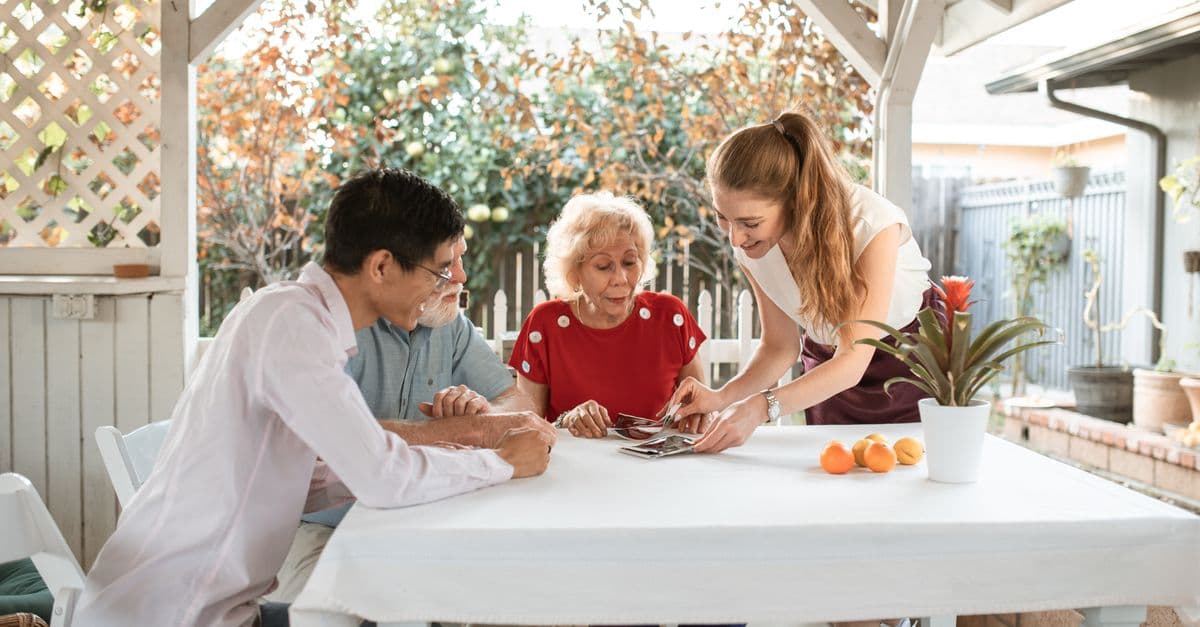 A family being shown around a residential aged care home