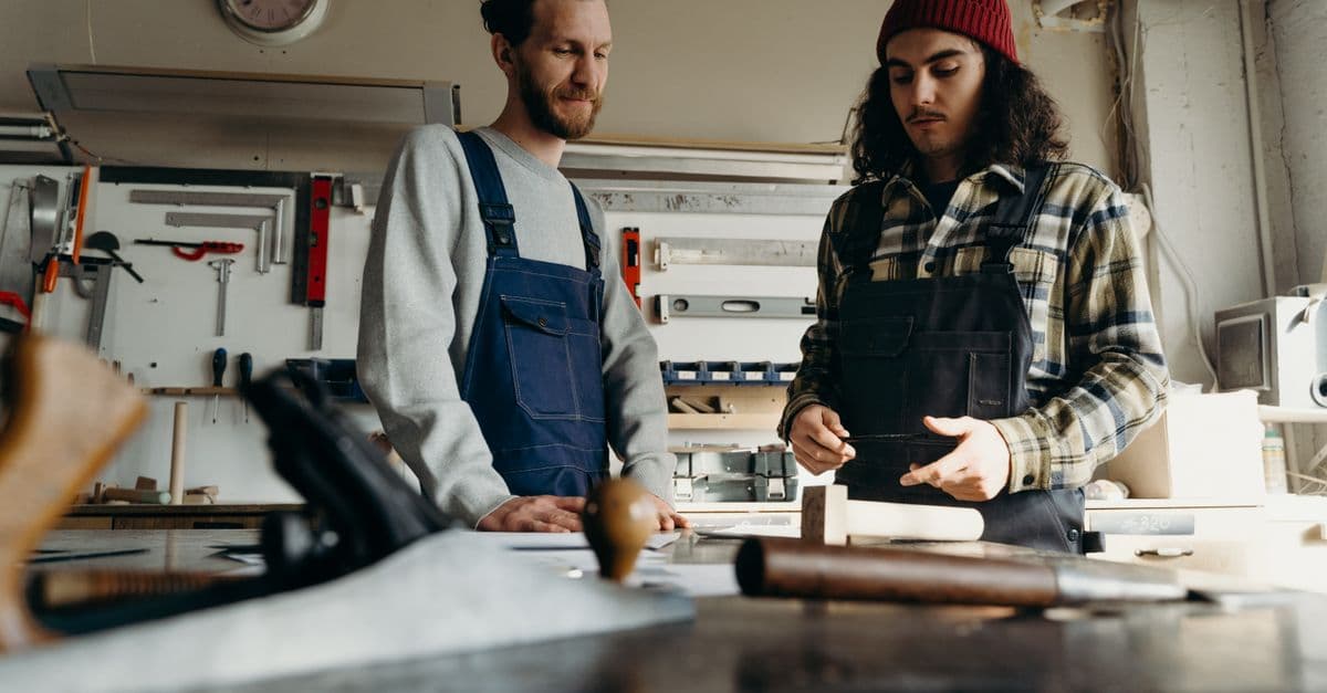 Two men working together in a community workshop