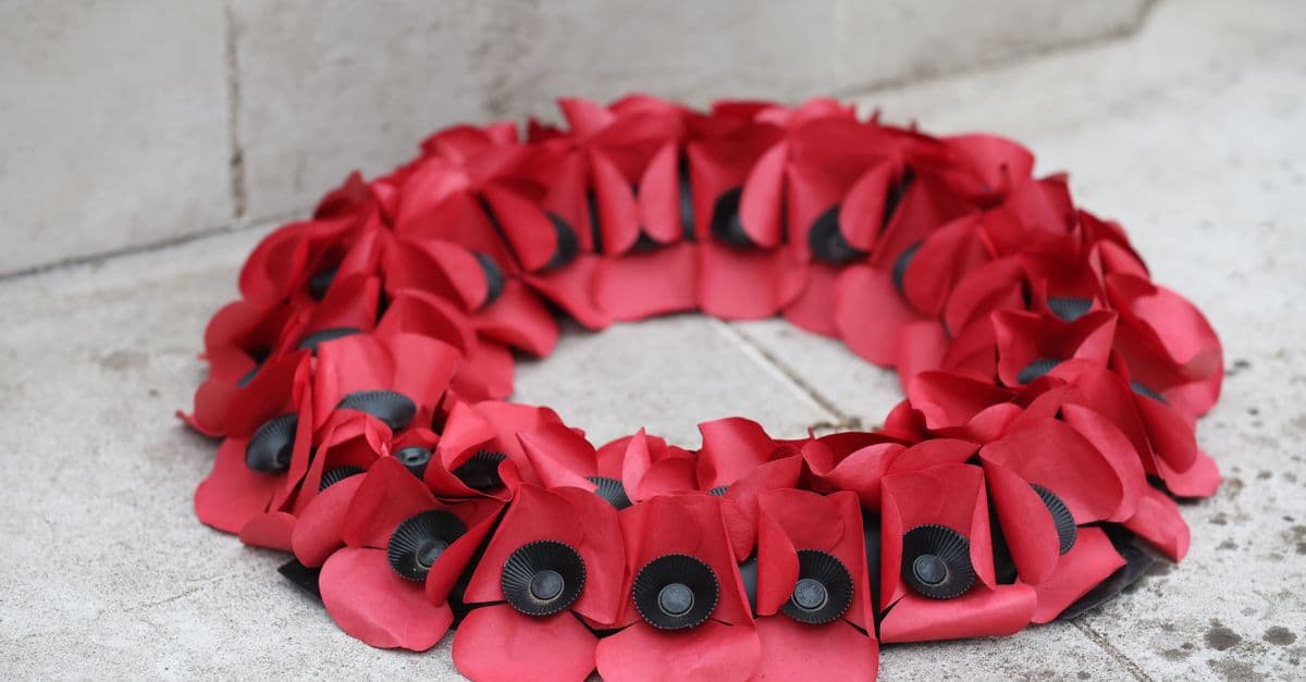 A red poppy wreath laid in remembrance