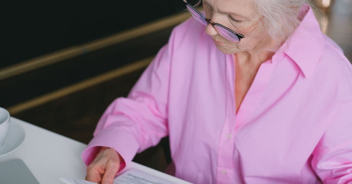 Someone reviewing aged care home cost documents