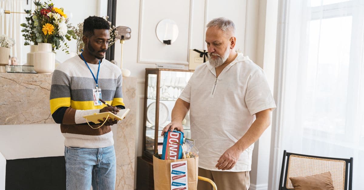 A community support worker with an older adult
