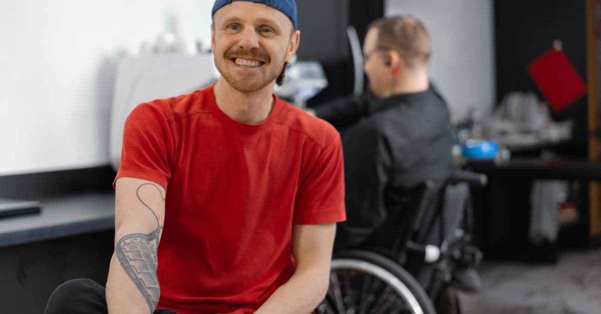A support worker and a participant out in the community