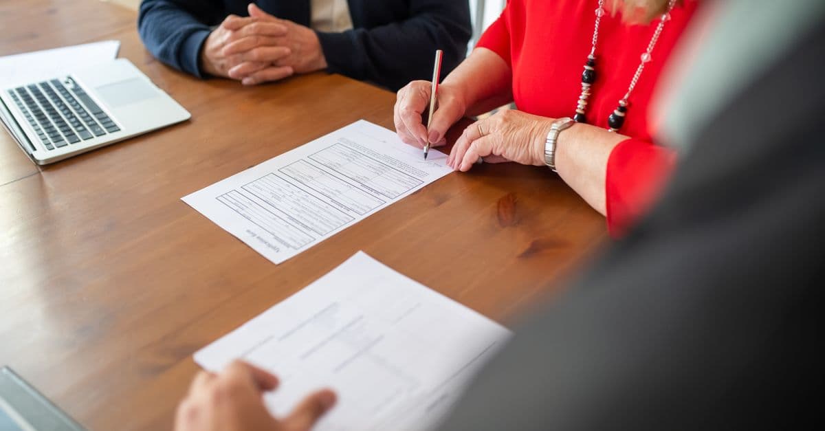 A couple reviewing retirement village contract documents