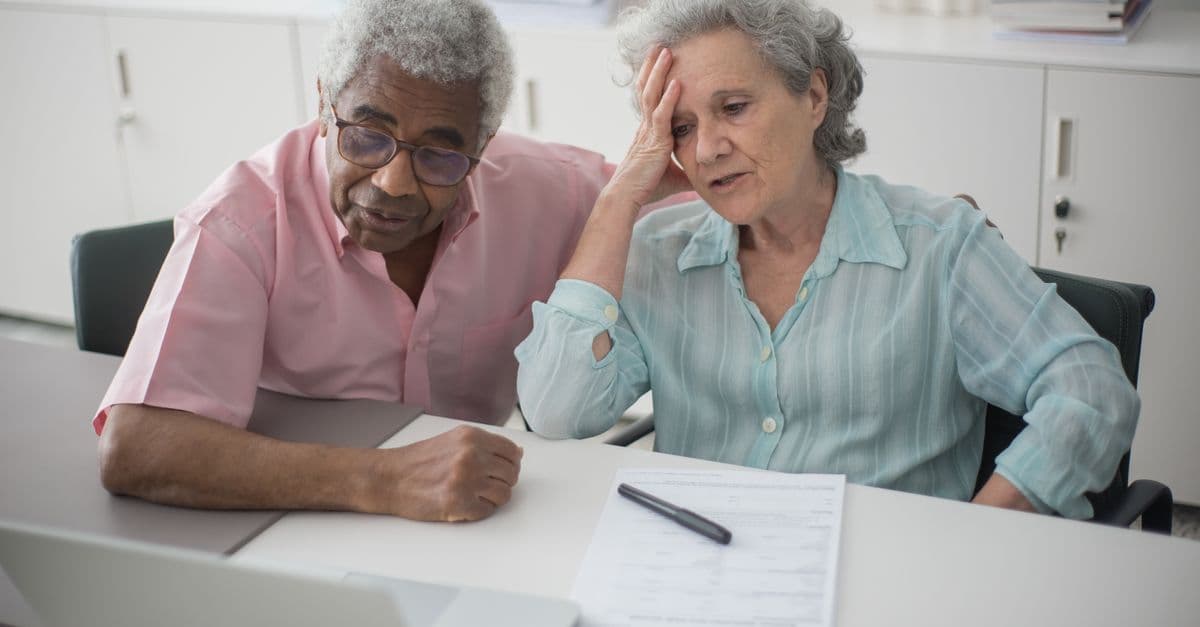 An older woman discussing home care funding with an advisor
